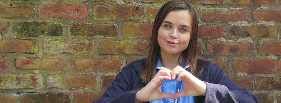 Care worker making a heart with her hand