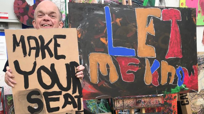 Man holding sign